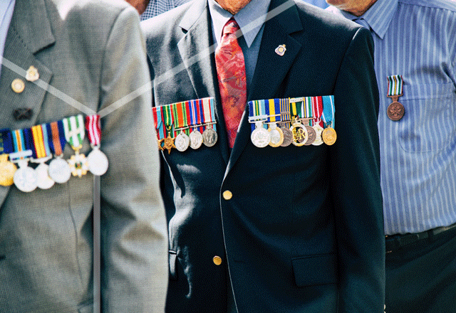 Medals on war veterans' jackets.